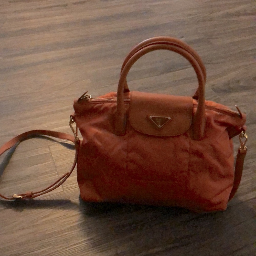 - Prada crossbody or satchel